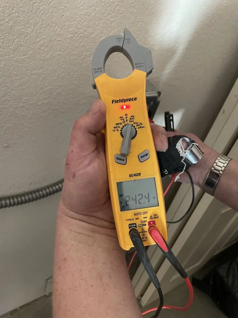 Voltage testing with clamp meter during Recessed Lighting Installation in Boylston